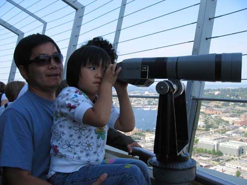 Emily looking through a telescope on the O-Deck